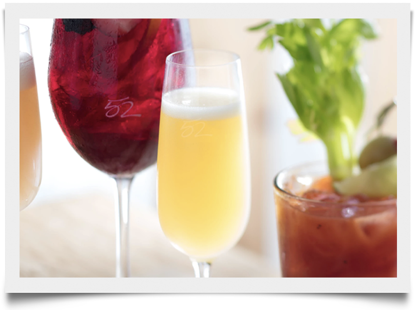 Get a Mimosa cocktail at Seasons52, made with sparkling wine and orange juice.