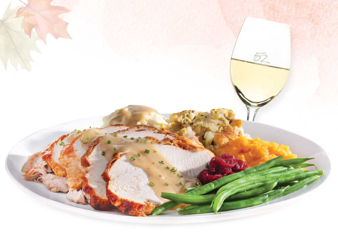 Thanksgiving dinner featuring roasted turkey, cranberry butter, savory pan gravy, Yukon mashed potat…