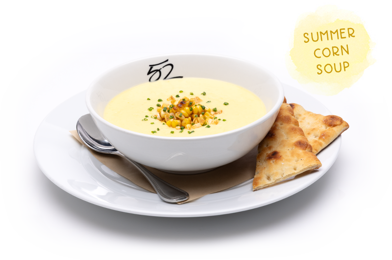 Summer Corn Soup topped with corn, bacon and chives, served with naan bread.